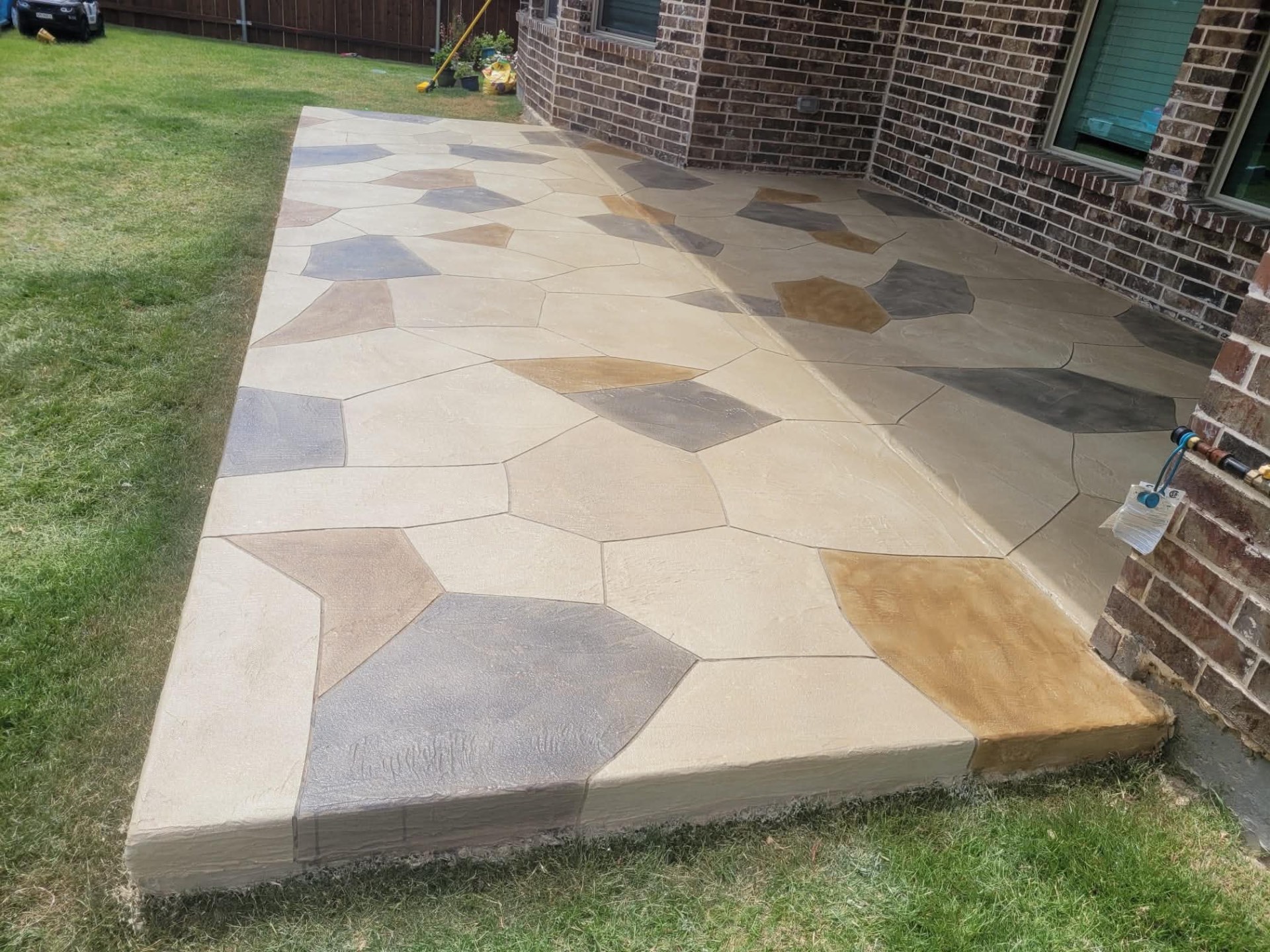 Flagstone Stamped Patio in Arlington, TX by Junior Concrete
